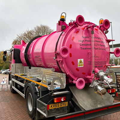 Vehicle graphics applied to a pink tanker truck